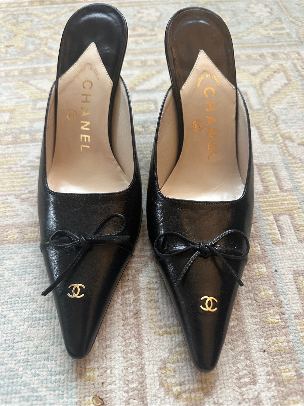 CHANEL Black Leather Pointed Toe Mules with Gold CC Charm - size 37